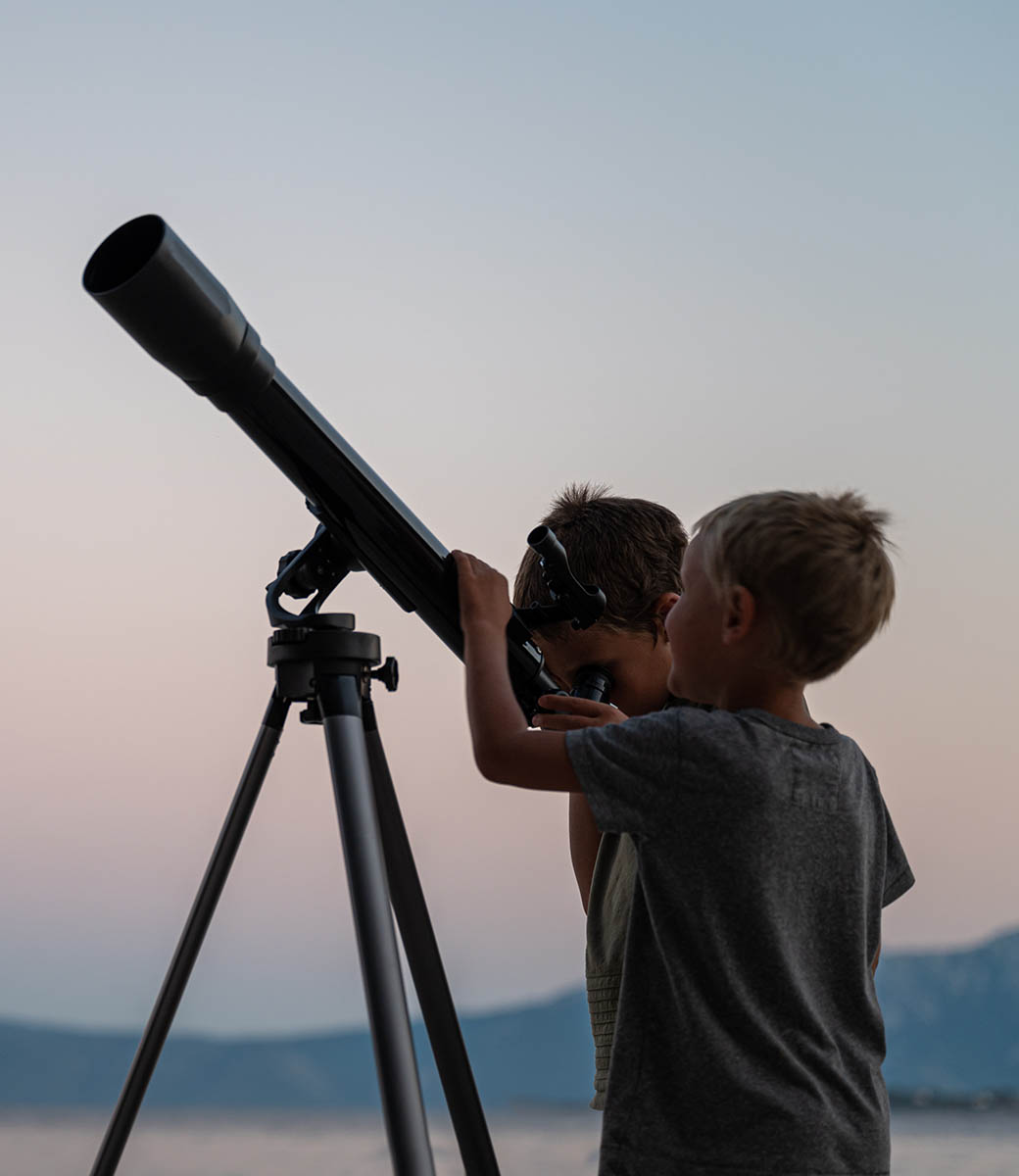 two-brothers-looking-at-the-stars-using-a-telescop-2021-08-29-09-32-08-utc-copy3.jpg